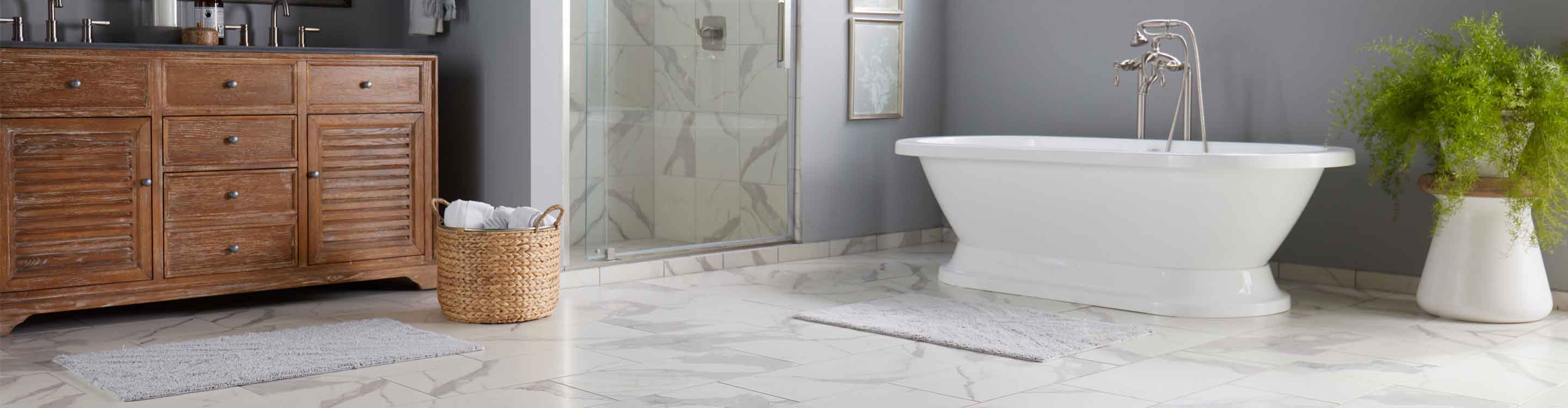 Marble tile floor in bathroom with bath tub. 